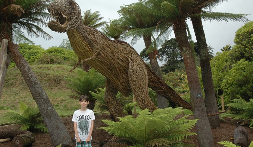 Archie McFegan meets the new willow dinosaur at Logan Botanic Garden
